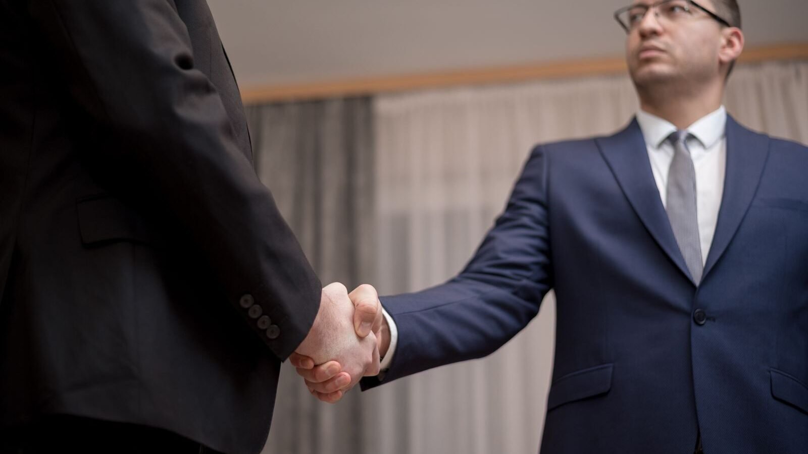 Business handshake closing a partnership with a nonprofit organization