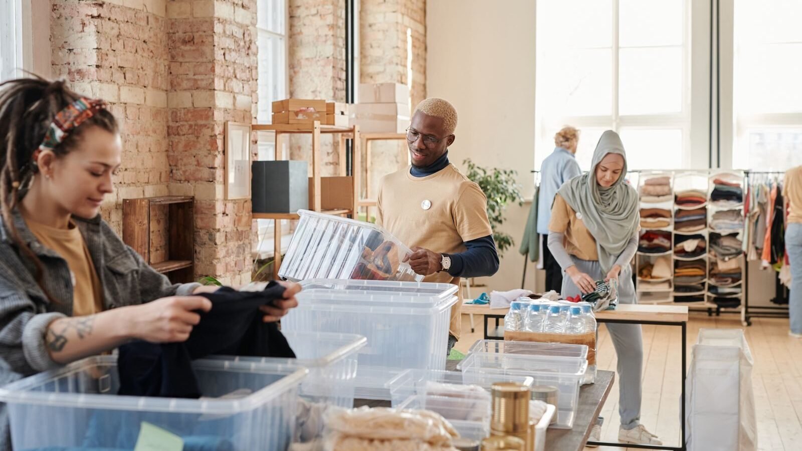 Community volunteers sorting donated goods at a nonprofit center