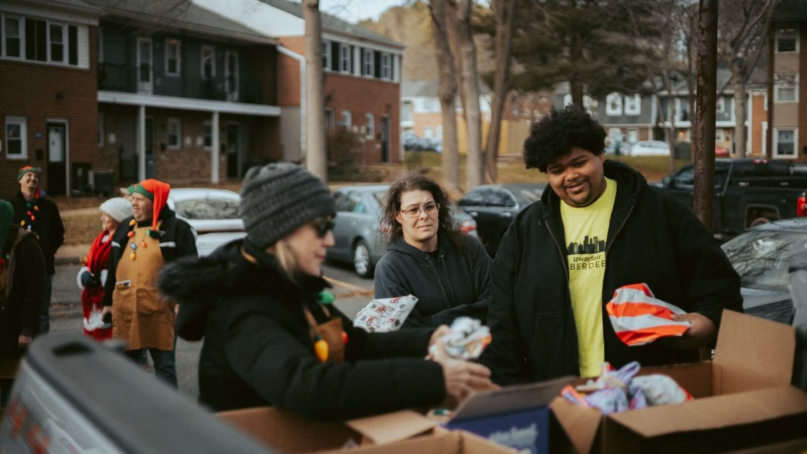 Volunteers distributing food during a holiday charity drive