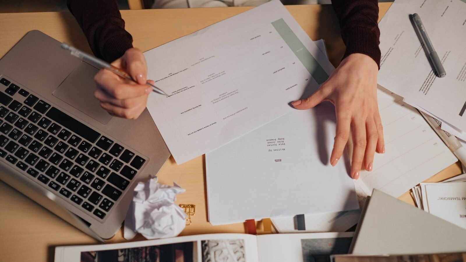 Notes and documents on a desk while looking up nonprofit records